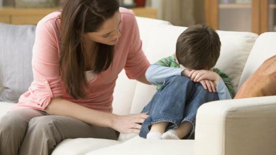 Caucasian mother comforting son