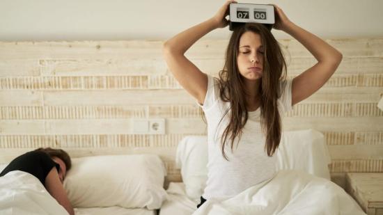 woman in bed with burnout